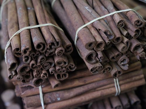 Free Close-up of cinnamon sticks bundled together, showcasing texture and spice aroma. Stock Photo