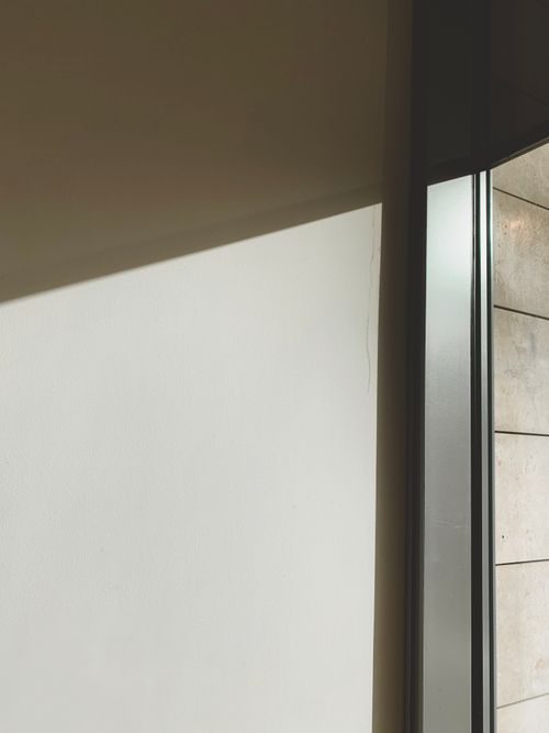 Free Elegant inside view of minimalistic architecture with soft lighting and clean lines. Stock Photo