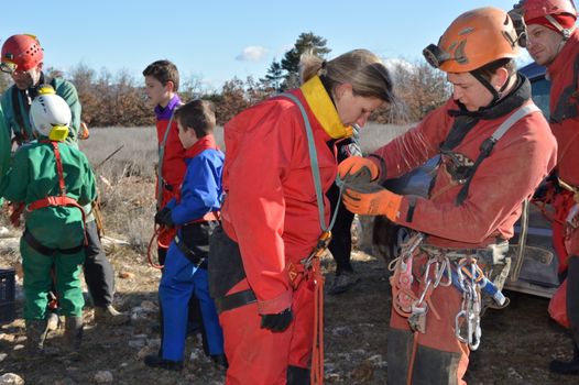 People Wearing Speleology Equipment