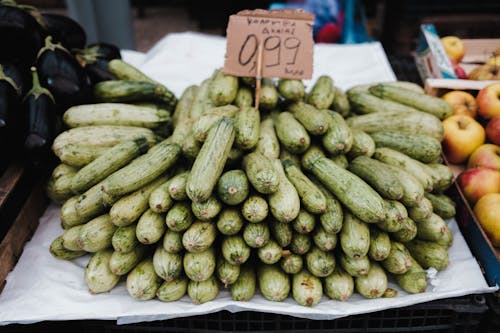 Stack of Zucchini on a Market Stall