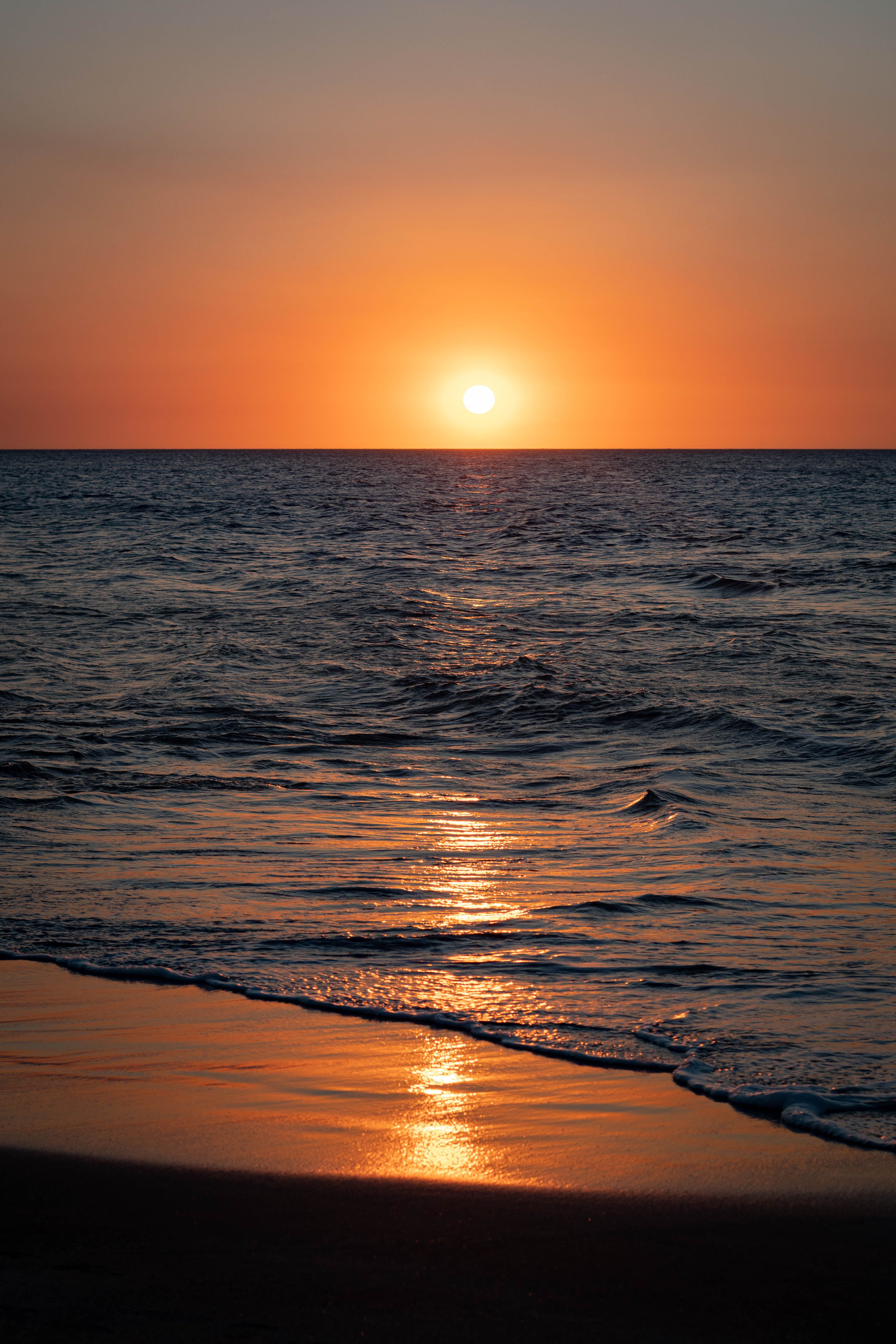 Stunning sunset over the ocean at Santa Marta, showcasing natural beauty and calm surroundings.
