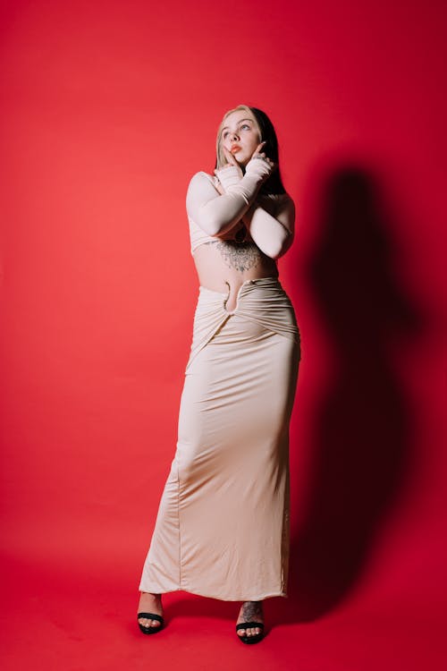 Young Woman Posing in a White Dress 