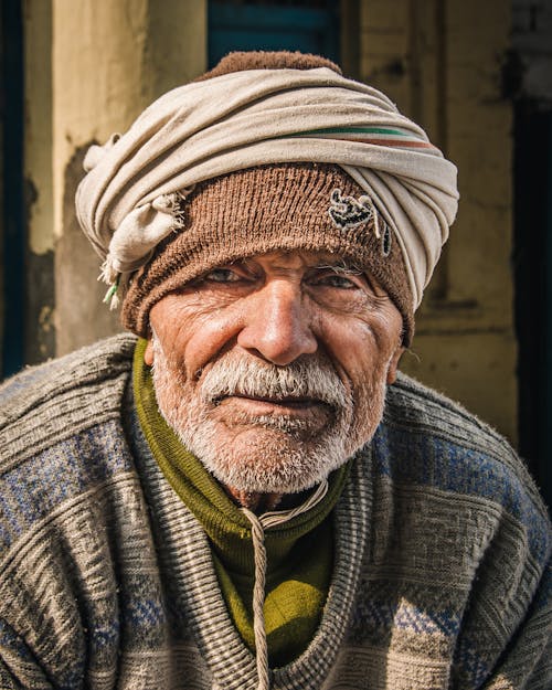 Portrait of Elderly Man Wearing Headscarf