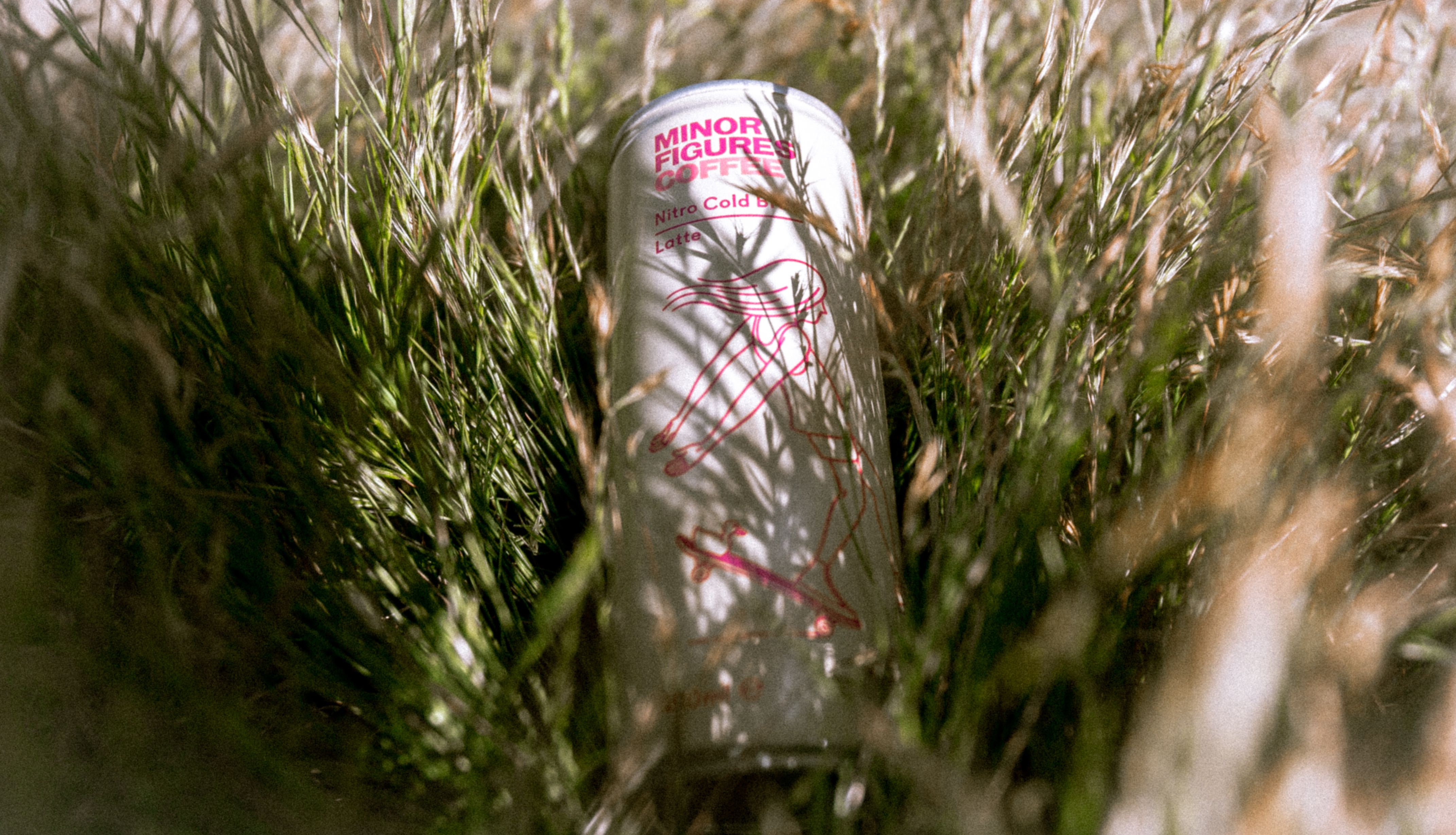 Person enjoying premixed canned coffee cocktail outdoors