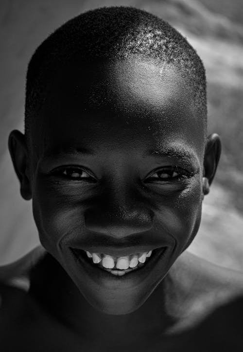 Black and White Portrait of a Smiling Boy