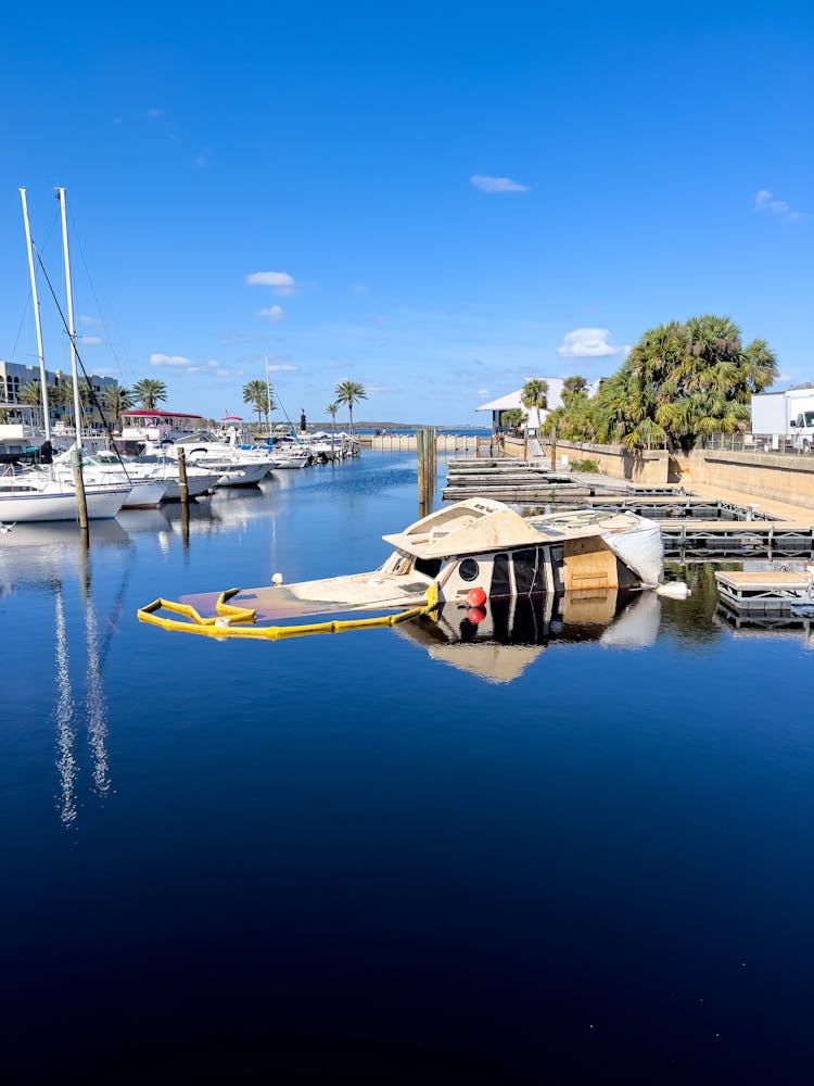 Blue Water And Boats Moored In Marina