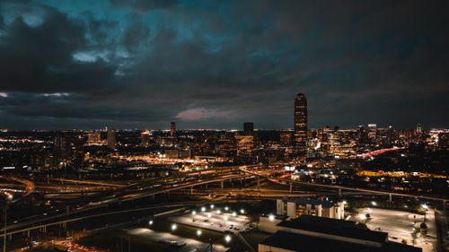 Free A breathtaking aerial shot of Houston's vibrant cityscape at night, featuring busy freeways and illuminated buildings. Stock Photo