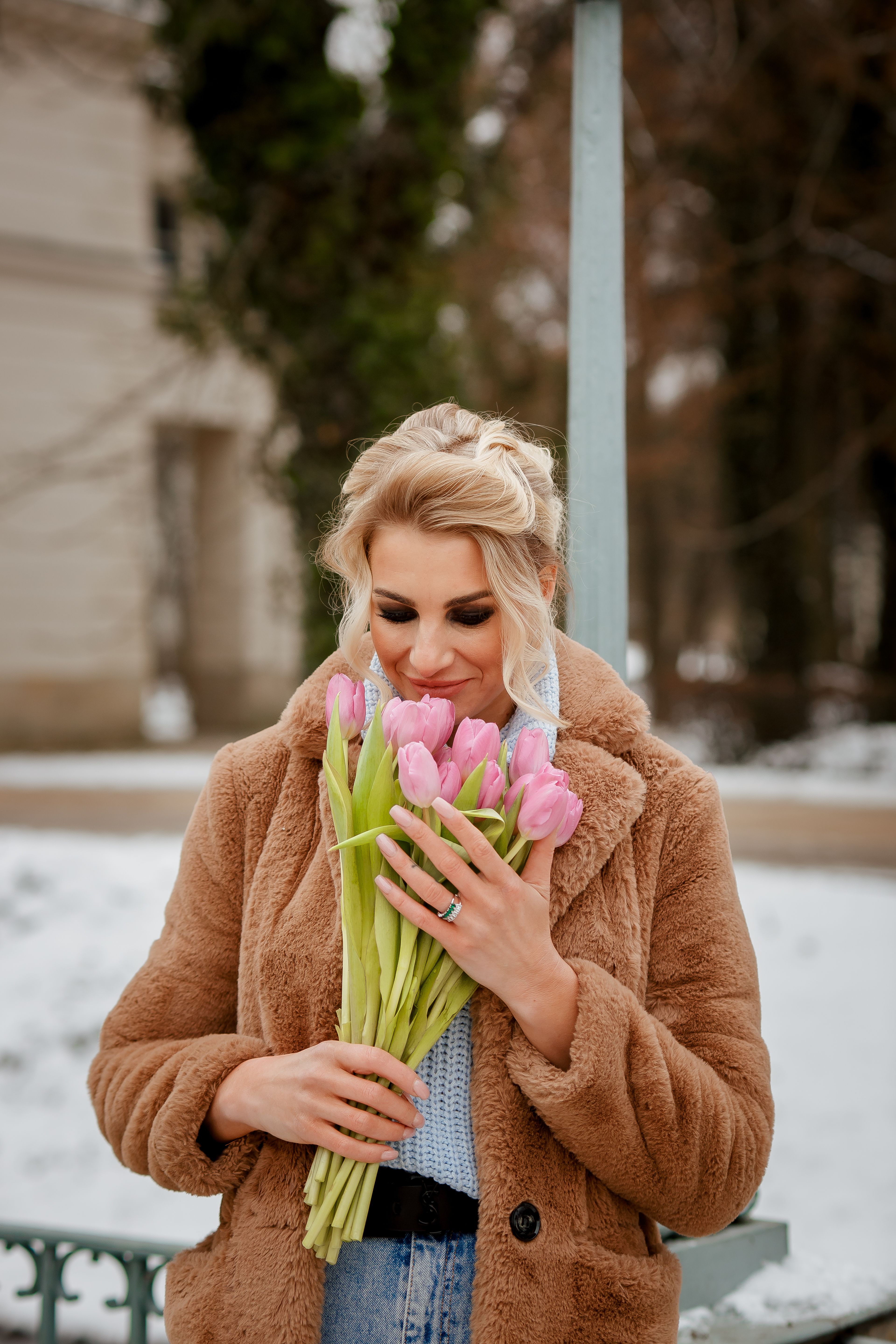 Woman Holding a Bouquet of Flowers · Free Stock Photo