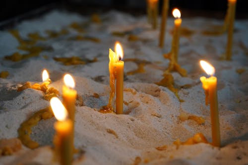 Wax Candles in Sand