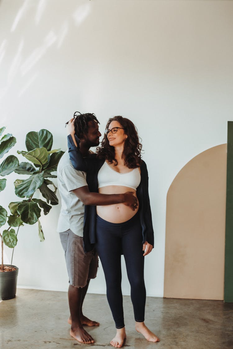 Man Hugging Pregnant Woman