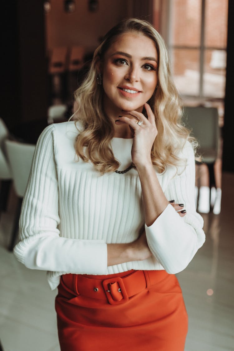 Elegant Woman In Red Skirt In Office