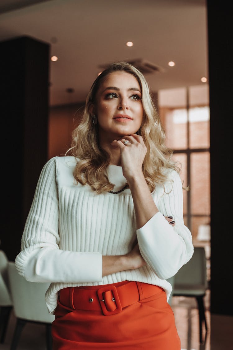 Elegant Woman In Red Skirt Standing In Office