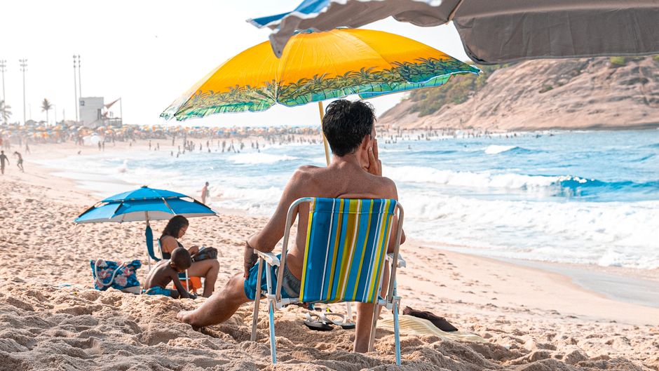 crowd watching beach shoreline