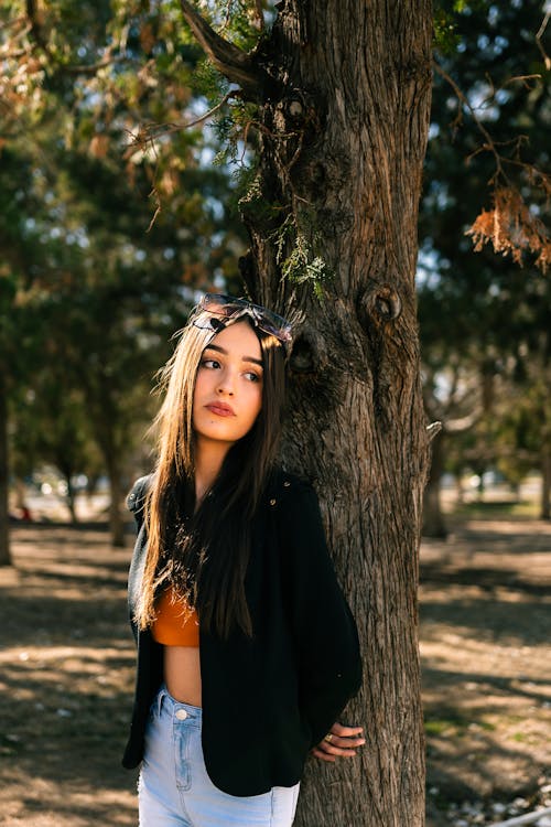 Woman Posing among Trees