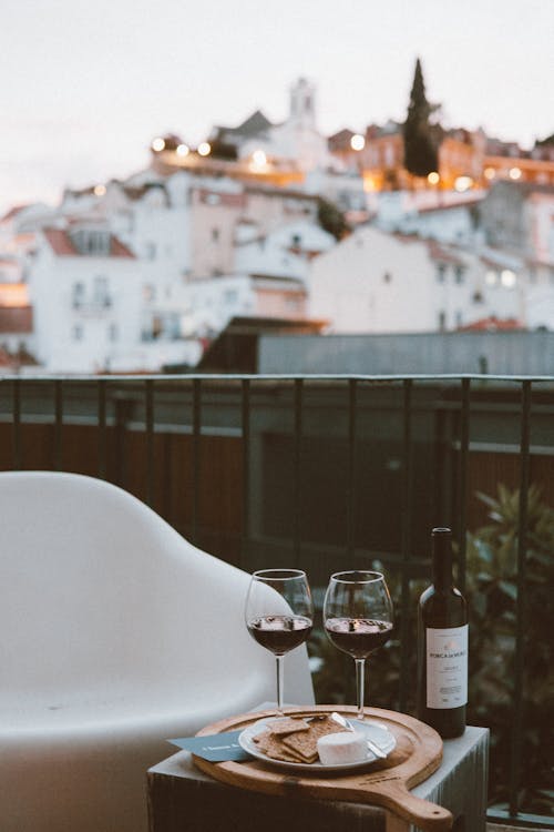 Two Clear Wine Glasses and Black Wine Bottle