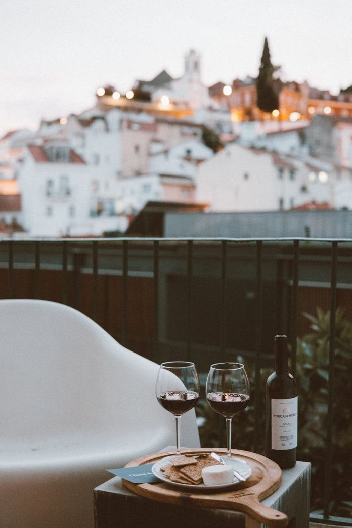Wine and cheese on a Lisbon rooftop in the evening