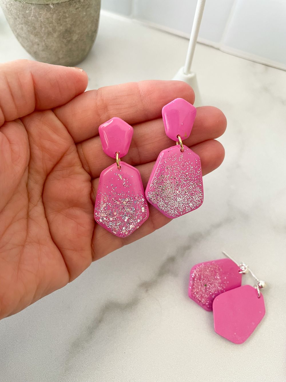 Handmade earrings glowing softly