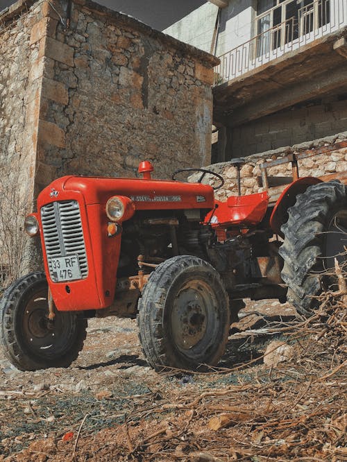 Tractor on Farm in Front of Building