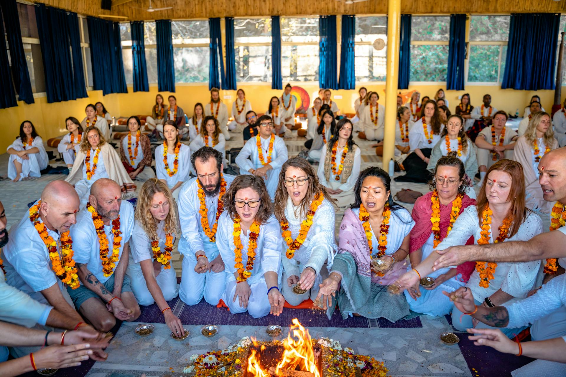 People Sitting by Burning Altar