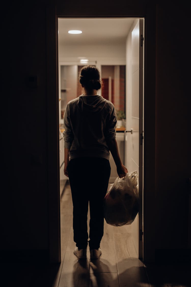 Person Standing Near Door Jamb