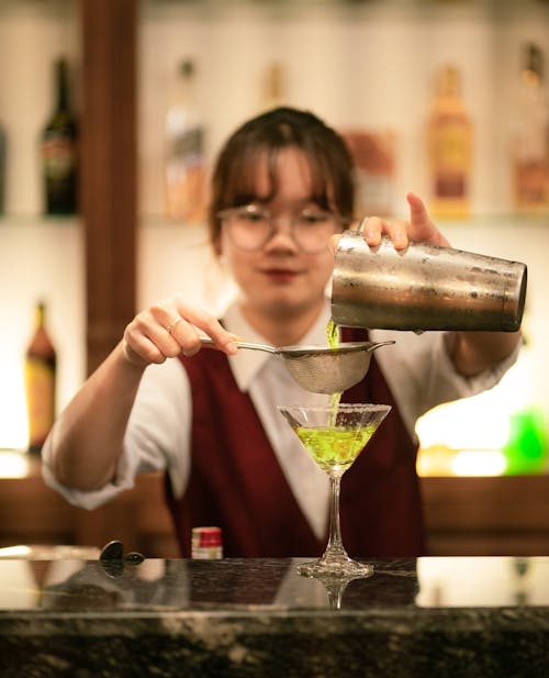 A Bartender Preparing a Cocktail 