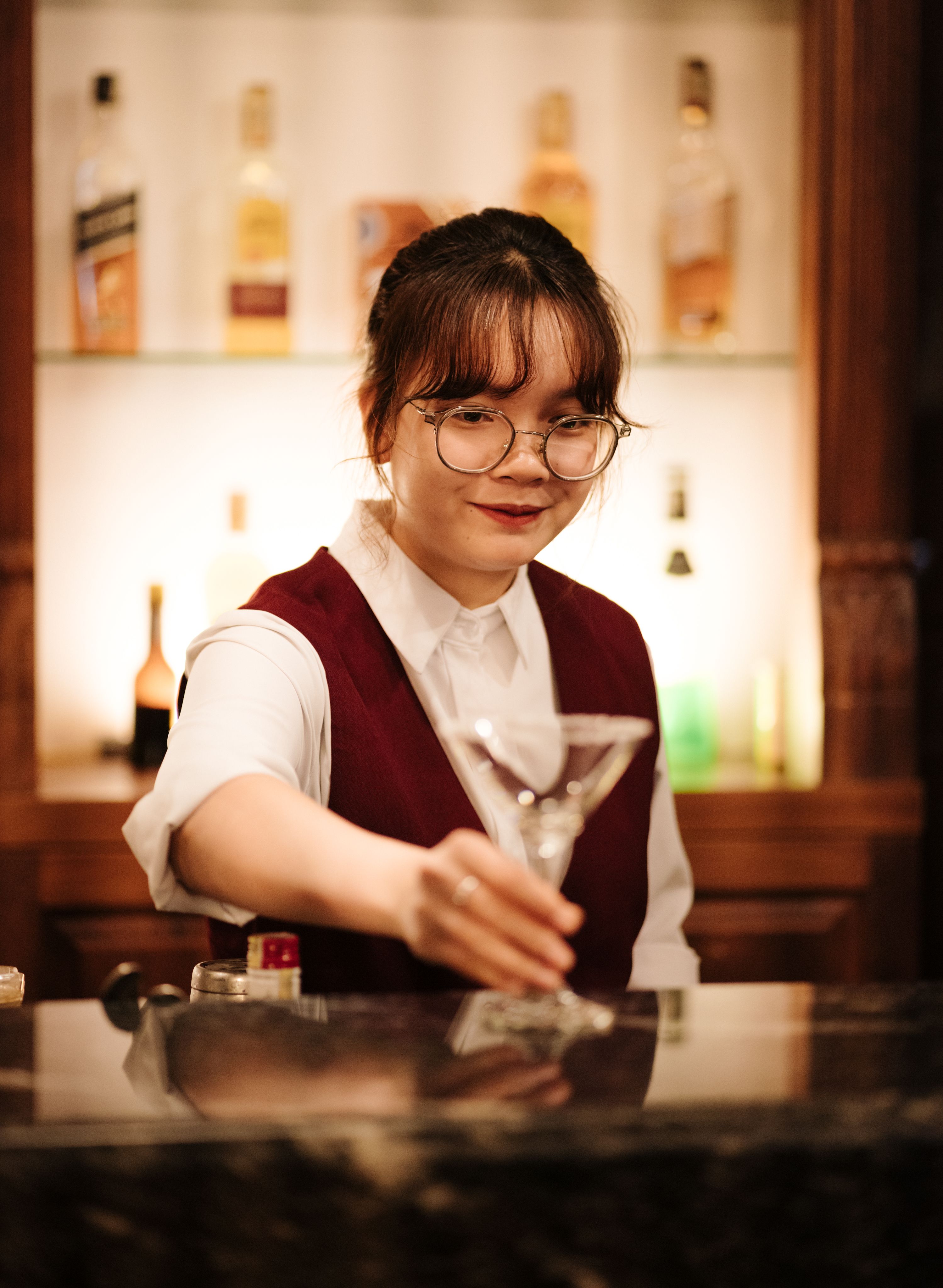 A Woman Wearing Eyeglasses Holding Glass of Wine · Free Stock Photo