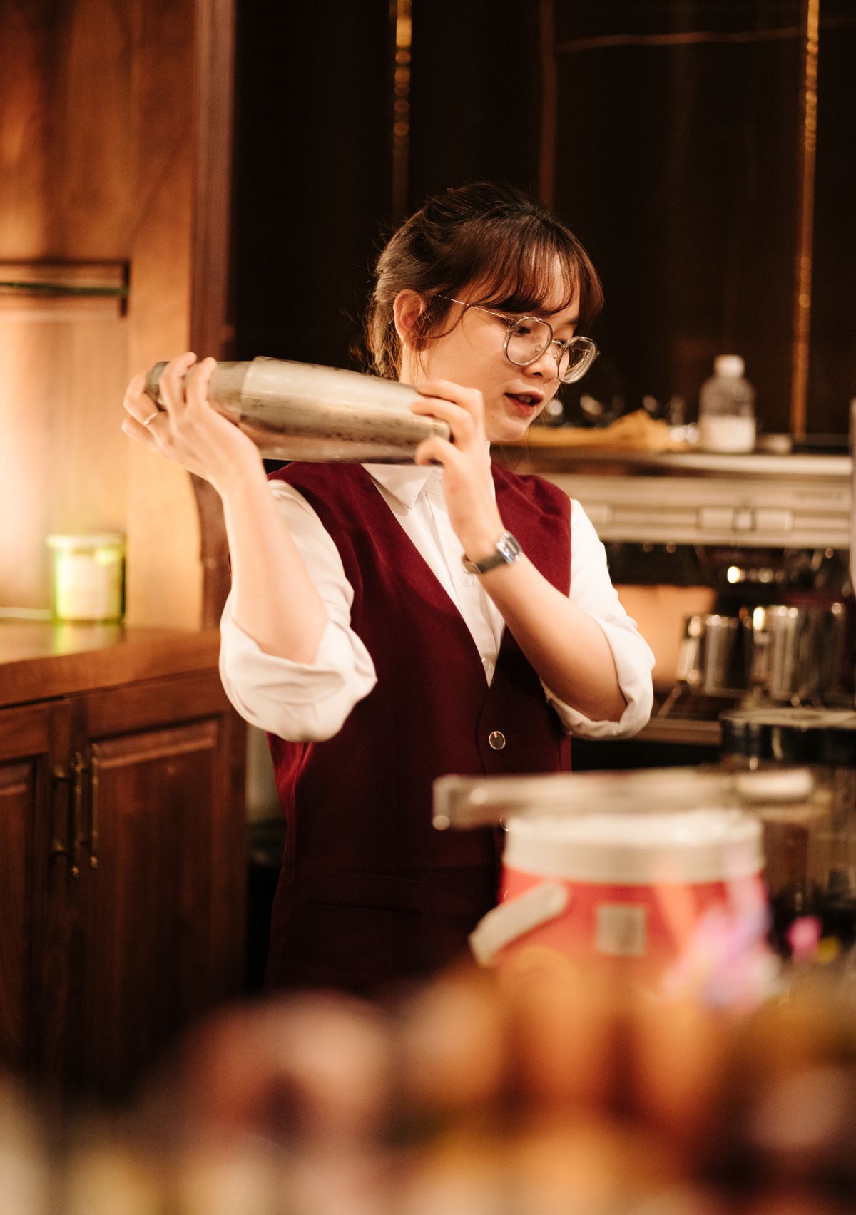 Bartender making Christmas cocktails at a holiday drinks bar