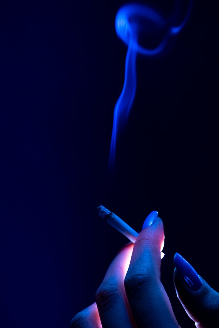 Cigarette In Woman Fingers