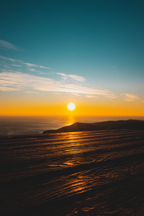 Scenic View of Sun over Sea of Clouds