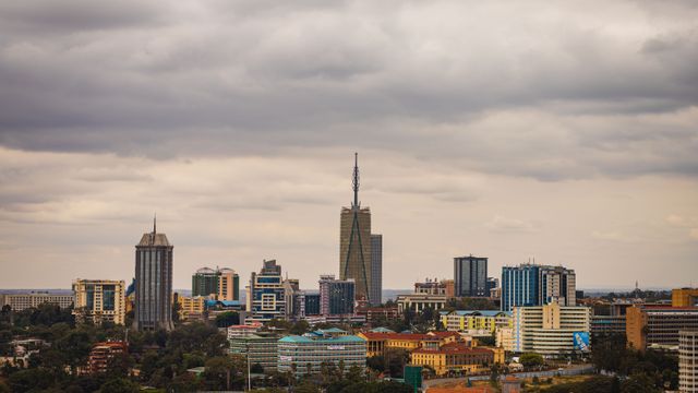 Explore the vibrant skyline of Nairobi with its modern skyscrapers under an overcast sky. — lounges at Nairobi Airport