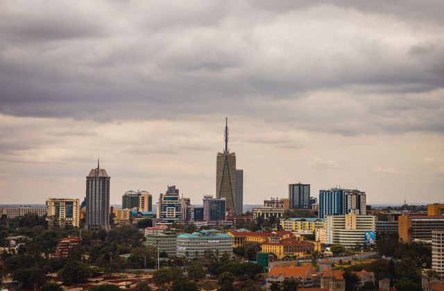 Explore the vibrant skyline of Nairobi with its modern skyscrapers under an overcast sky. — arriving in Nairobi