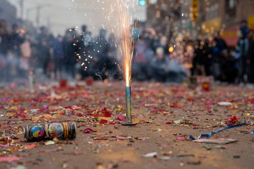 Free Colorful celebration featuring fireworks and confetti on a lively street. Stock Photo