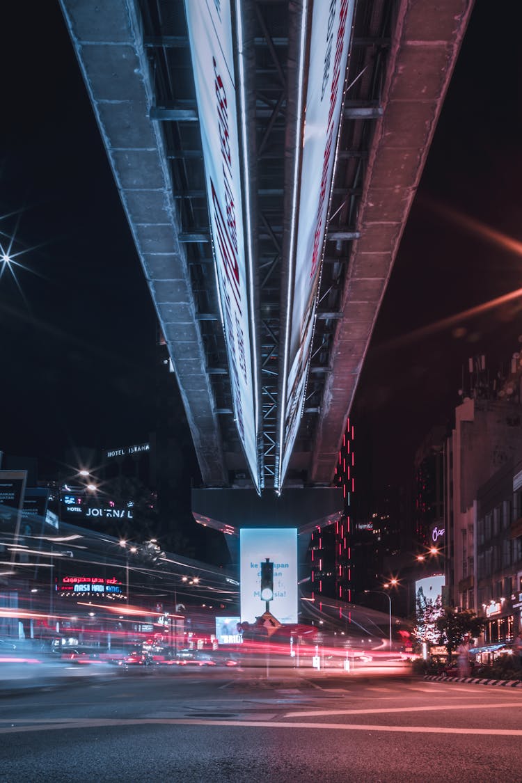 Timelapse Photo Of Intersection Under A Bridge