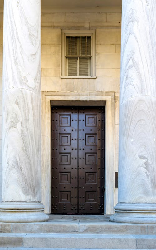 Wooden Doors in Historic Building with Columns