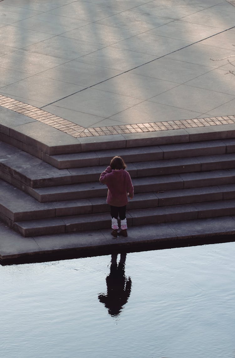 Girl Standing On Stairs On Square