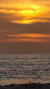 Peaceful sunset over the ocean with golden skies, perfect for calming vibes.