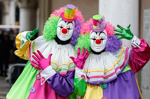 People Posing in Clowns Costumes