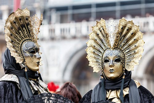 People in Costumes with Golden Masks