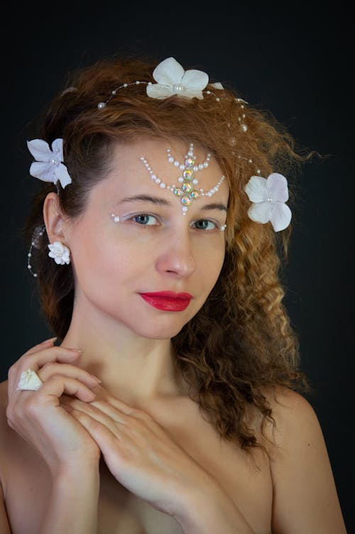 Woman Posing with Petals in Hair