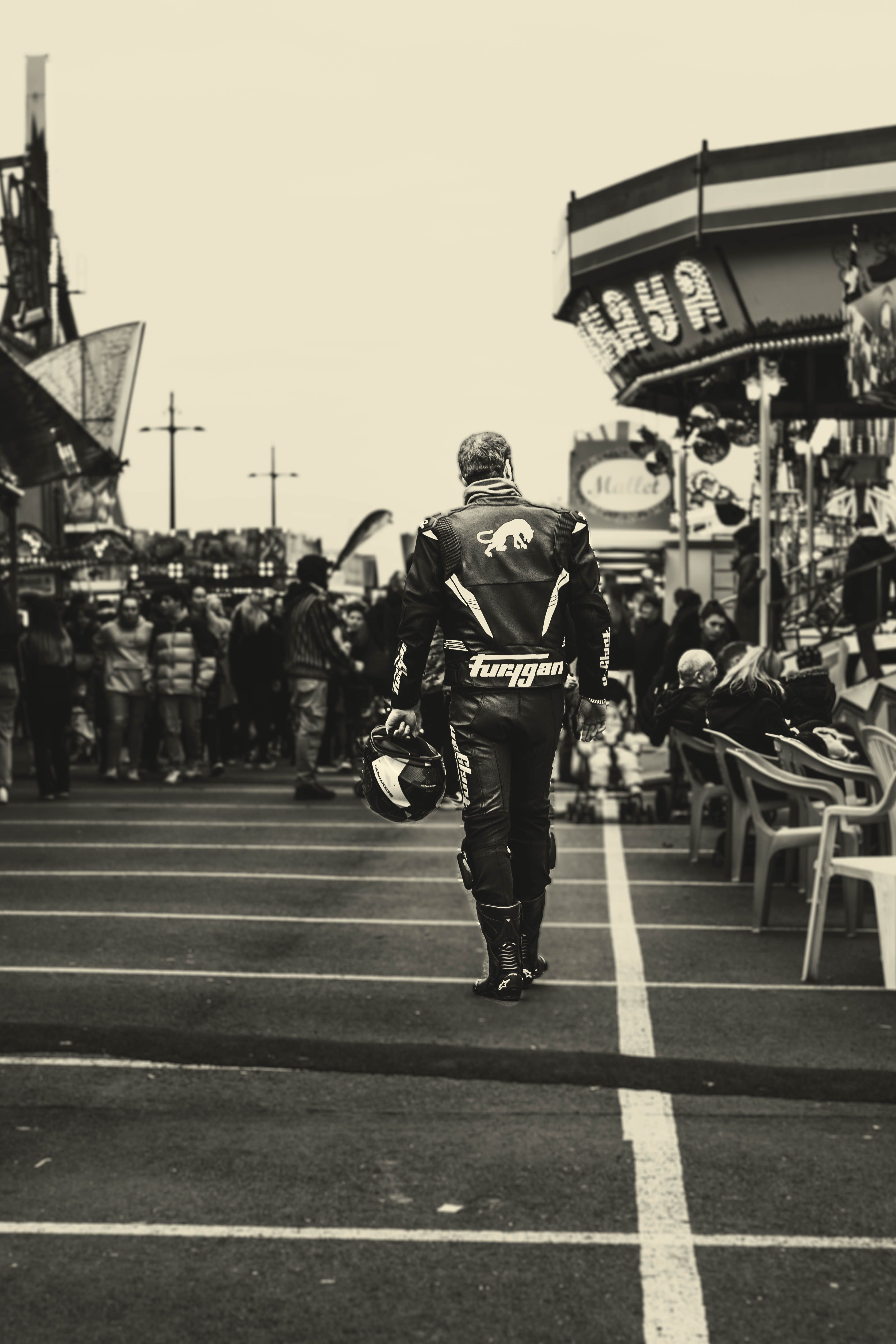Man Walking in Racing Suit · Free Stock Photo
