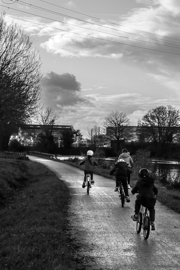 Kids Riding Bicycles On Road