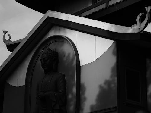 Black and White Photo of Buddha Statue at a Temple