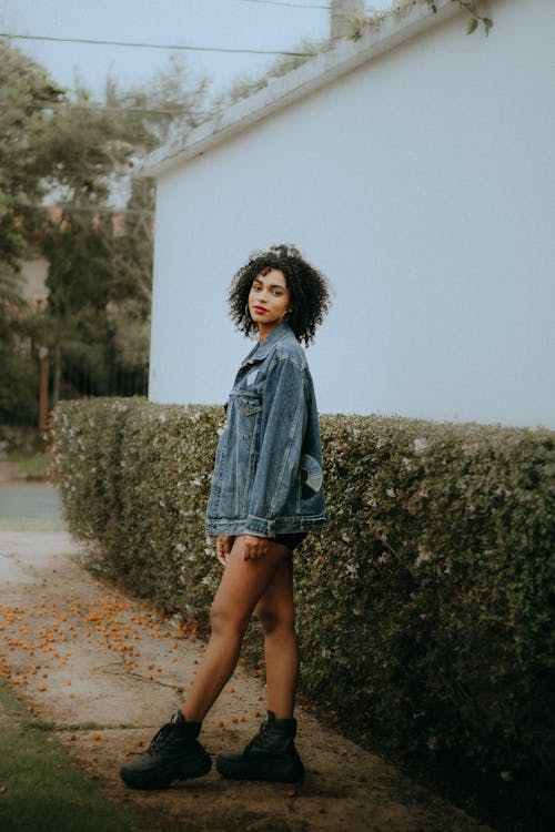 Fashionable Woman Wearing a Denim Jacket and Boots