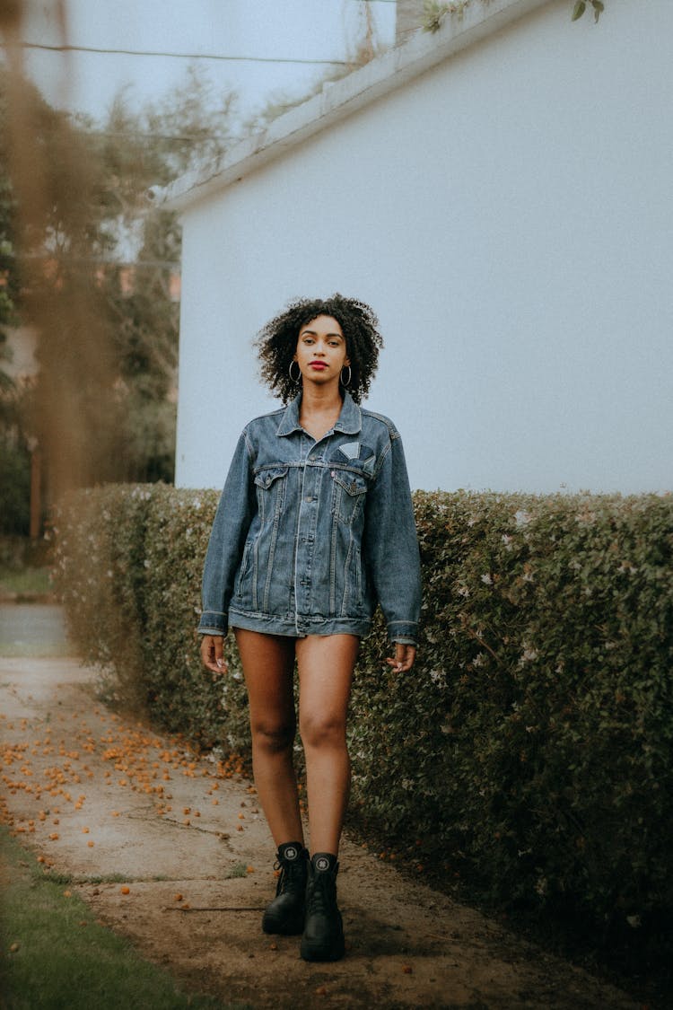 Fashionable Woman Wearing A Denim Jacket And Boots