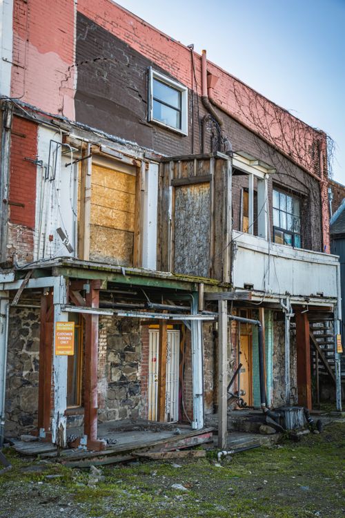 Free A decaying residential building with broken balconies, showcasing urban decay and abandoned architecture. Stock Photo