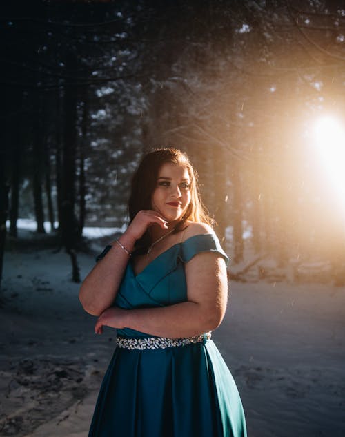 Woman Posing in a Turquoise Dress in a Forest