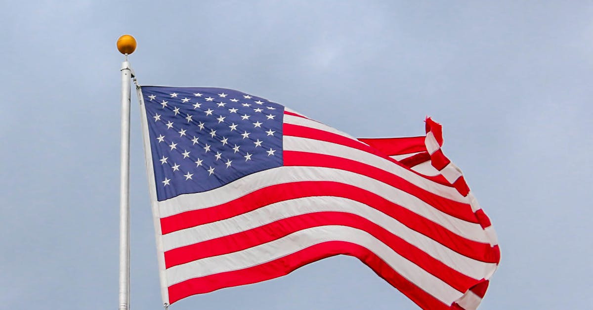 Usa Flag Waving On White Metal Pole