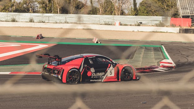 一辆红色跑车在户外赛道上疾驰的特写镜头，捕捉了速度与激情