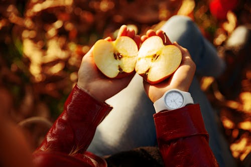 Person Holding Sliced Apple