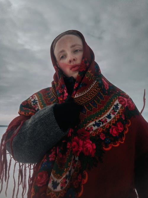 Woman Wearing a Coat and a Headscarf 